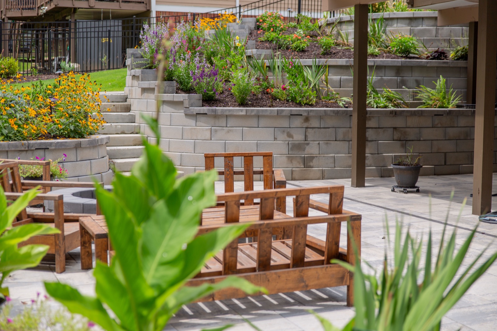 Custom paver patio and stone hardscaping installed by Your Company Name